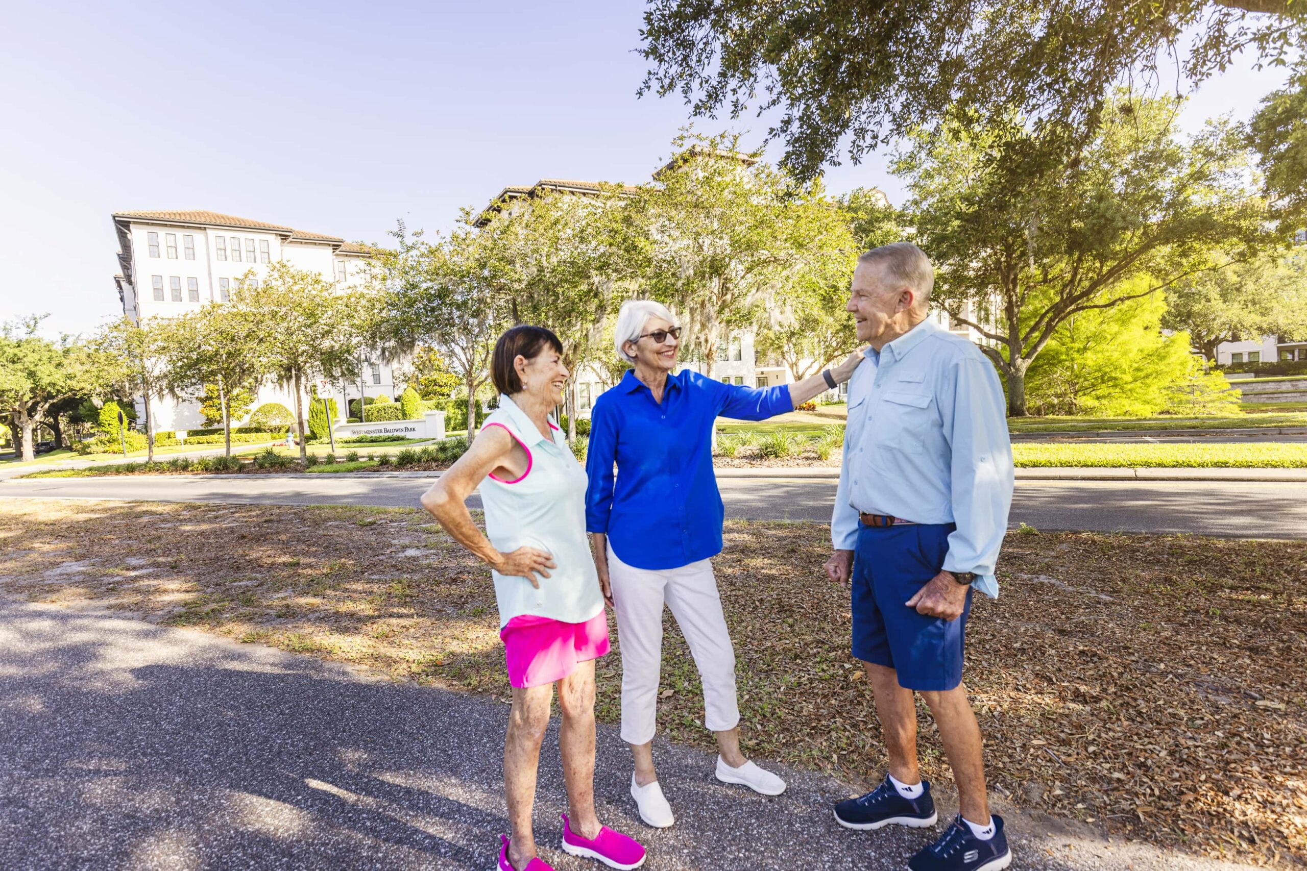 Senior man and two woman outside