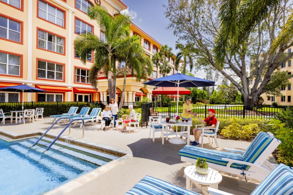 Senior friends gathering poolside