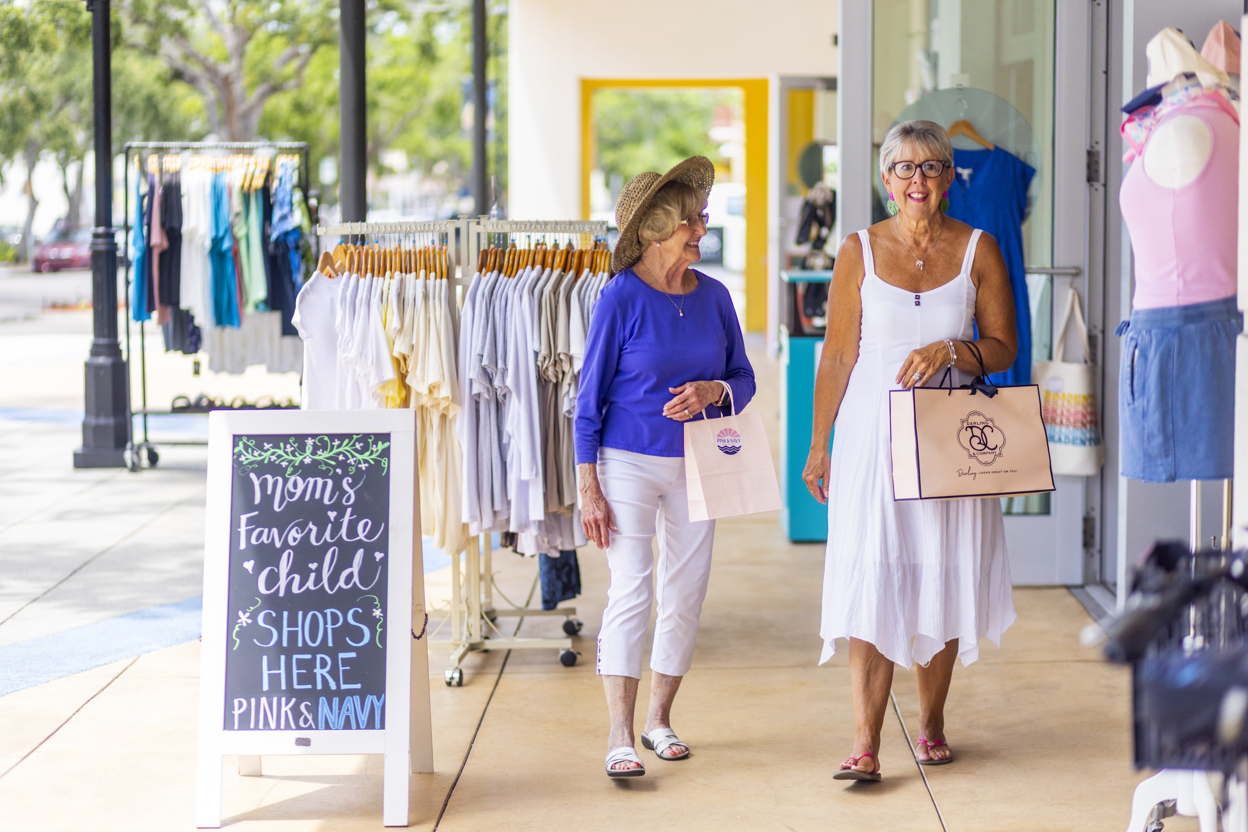 Senior friends shopping for new clothes