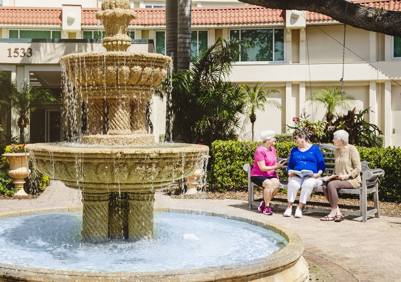 Seniors reading by water fountain