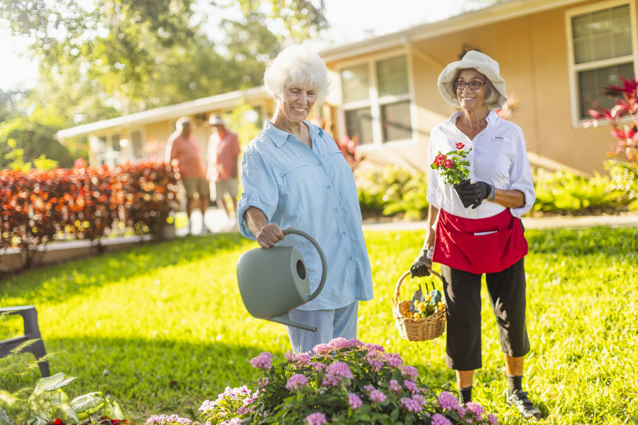 Seniors watering flowers