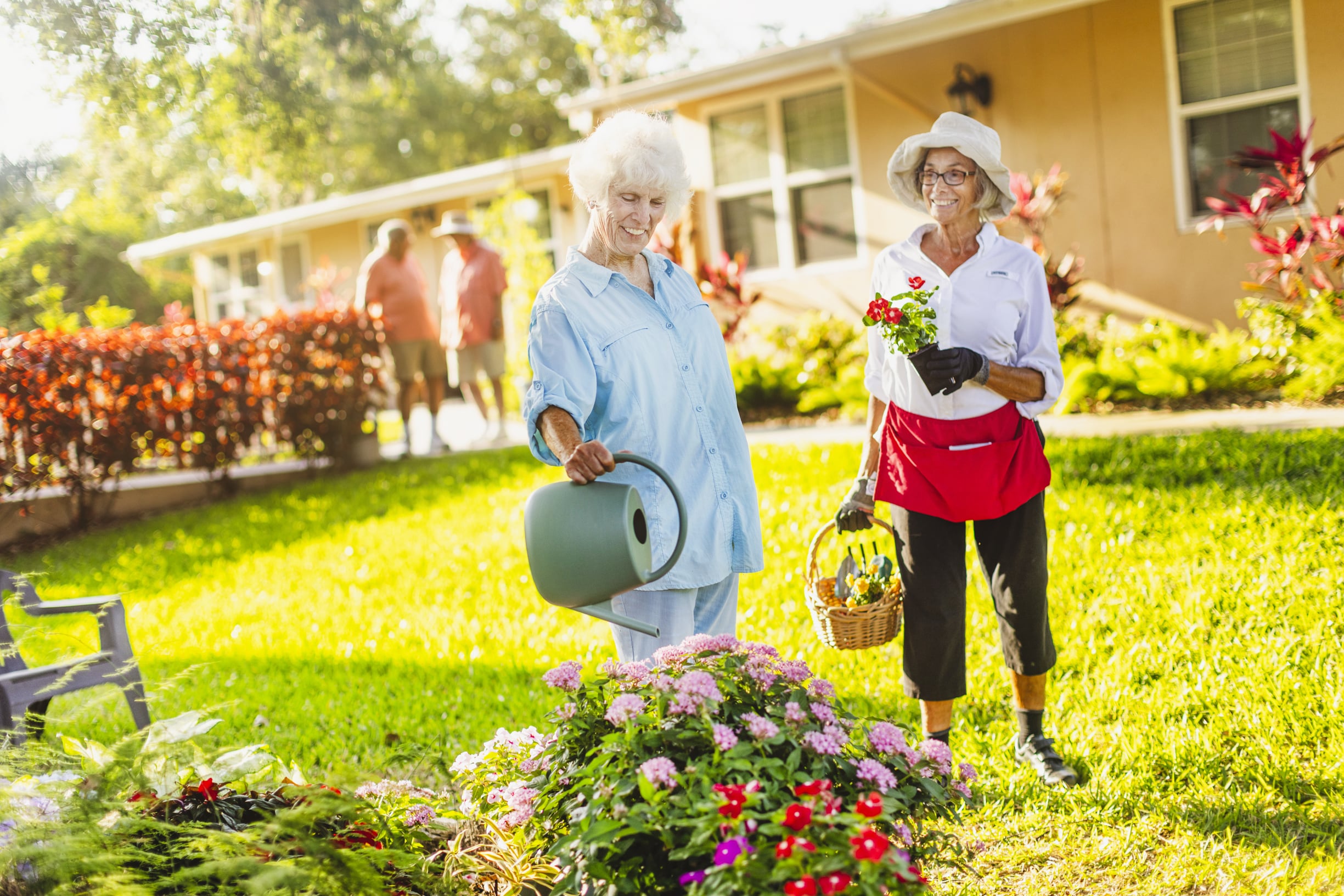 Seniors watering flowers