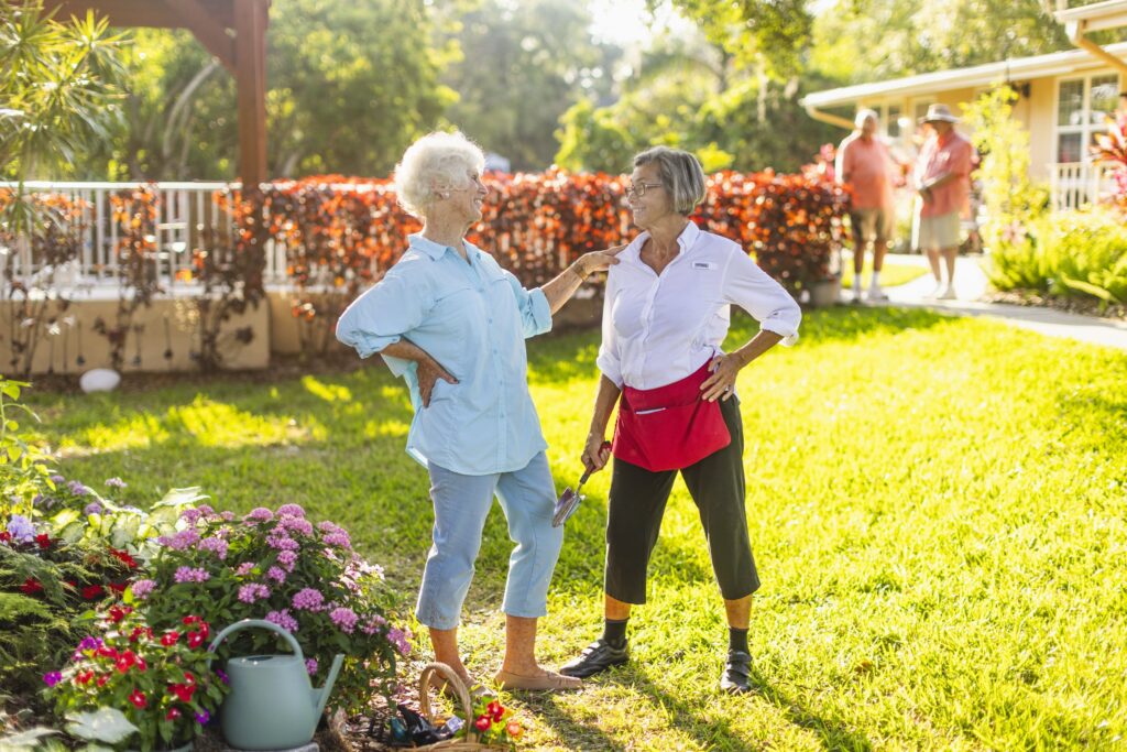 Seniors talking while gardening