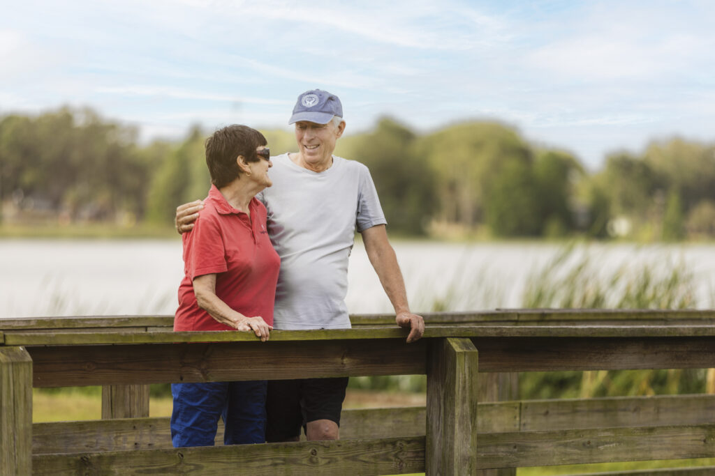 Senior couple standing by water