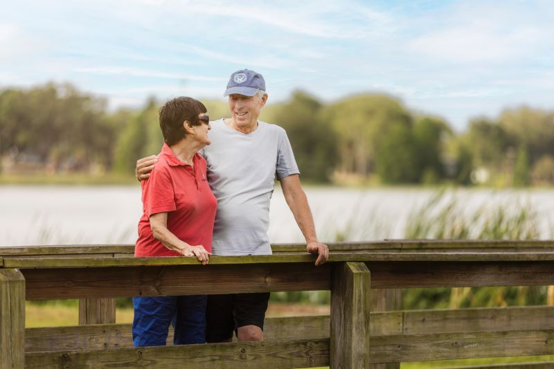 senior couple standing outside