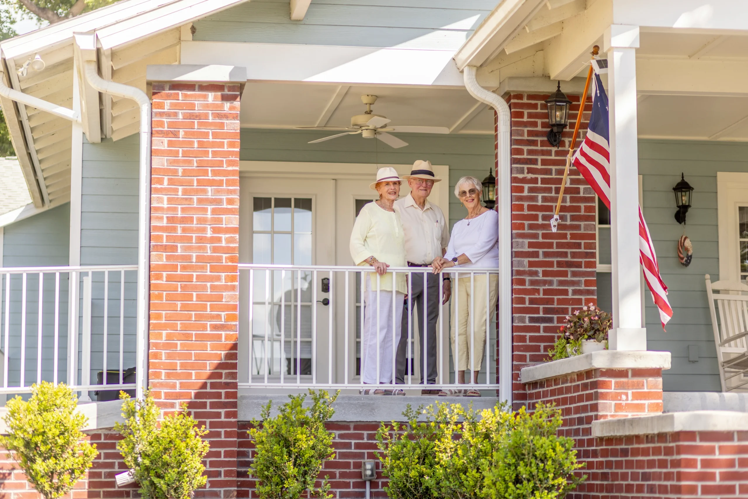 Seniors taking photo on porch
