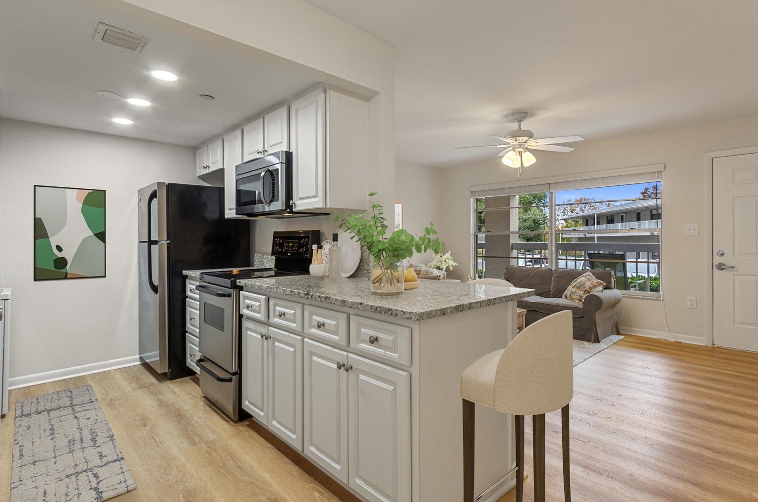 modern, open kitchen with bar looking out into living room