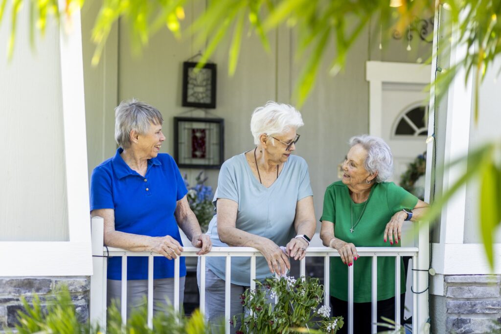 Seniors talking on porch