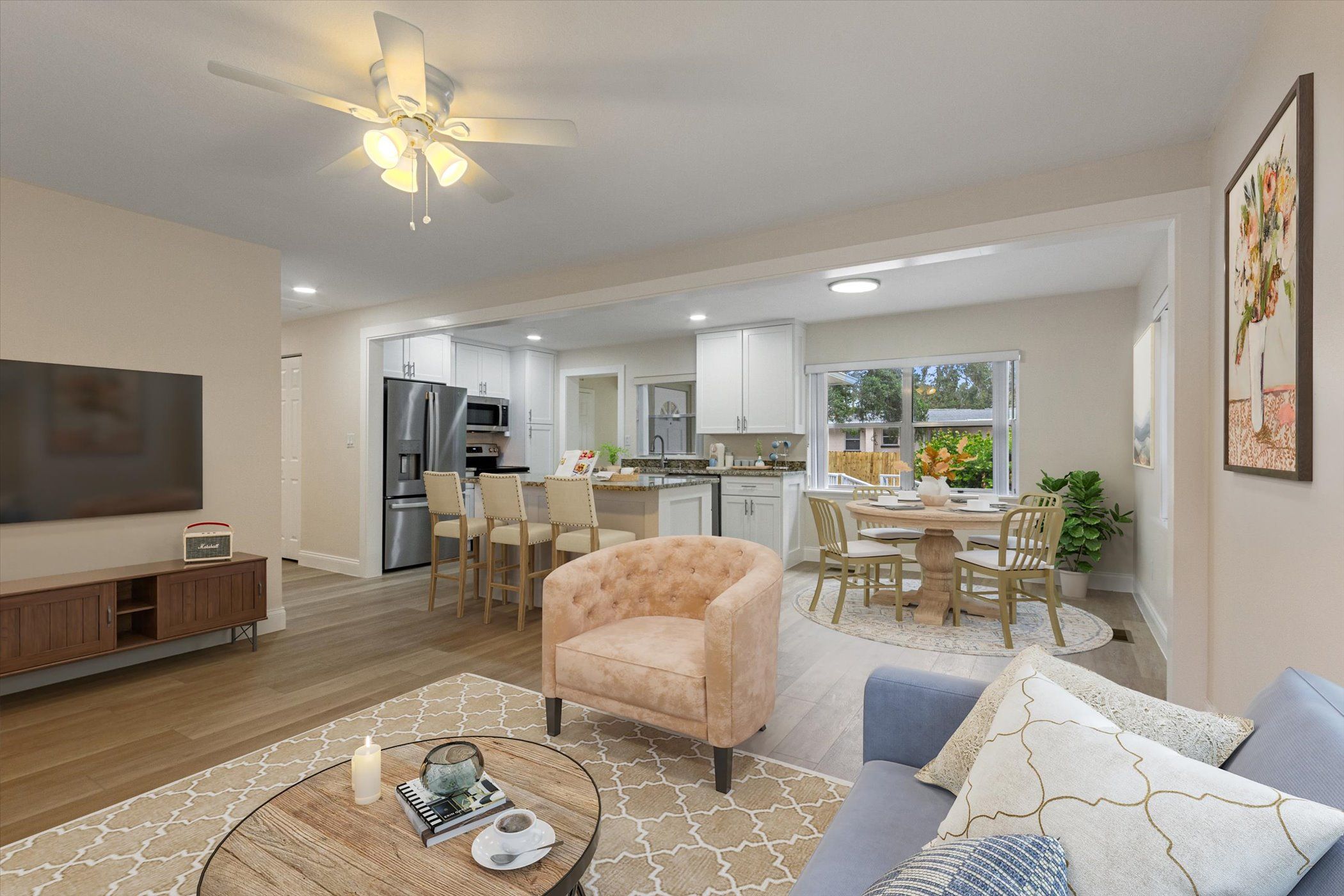 open space house showing living room and kitchen with bar