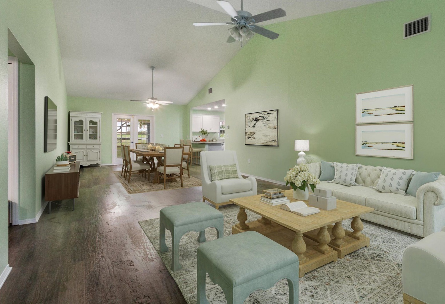 large open floor plan living room with cathedral ceiling looking into kitchen and dining room