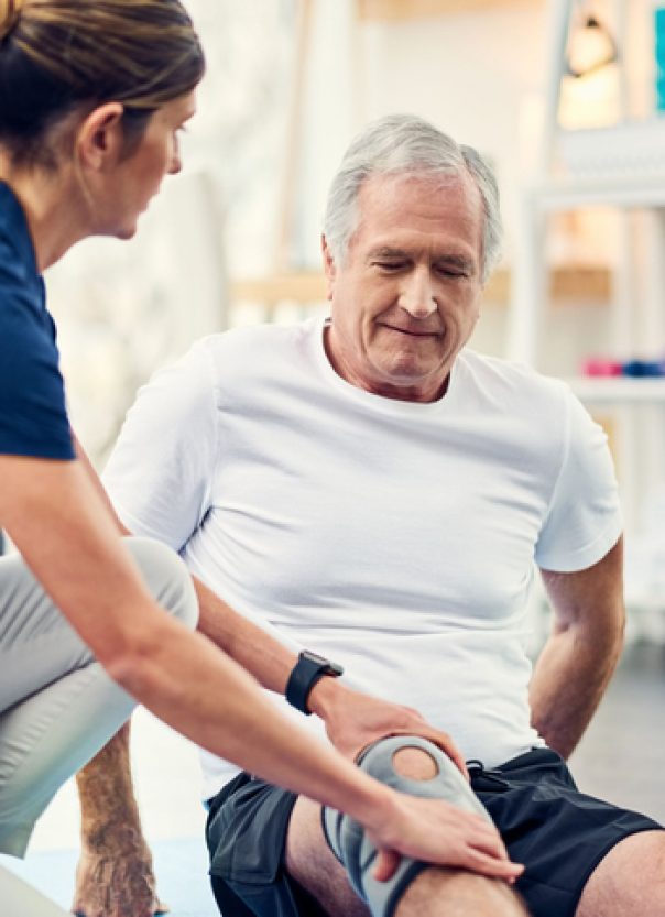 Cropped shot of an attractive young female physiotherapist working with a senior male patient