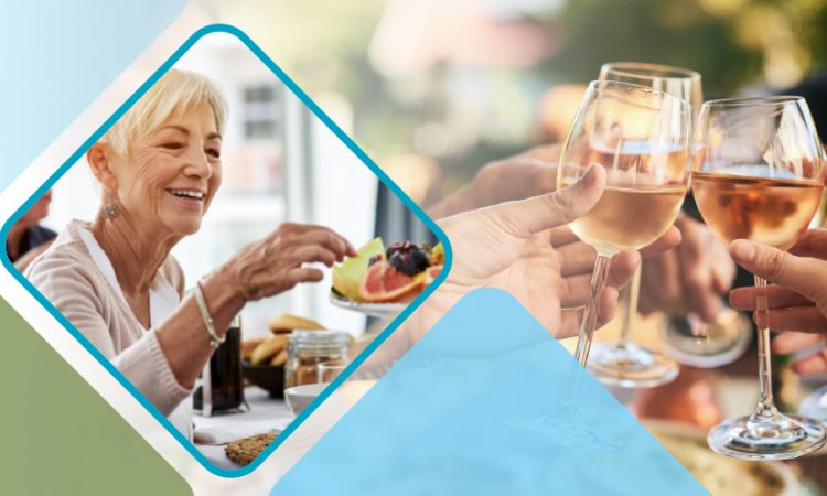 Seniors enjoying food and clinking wine glasses