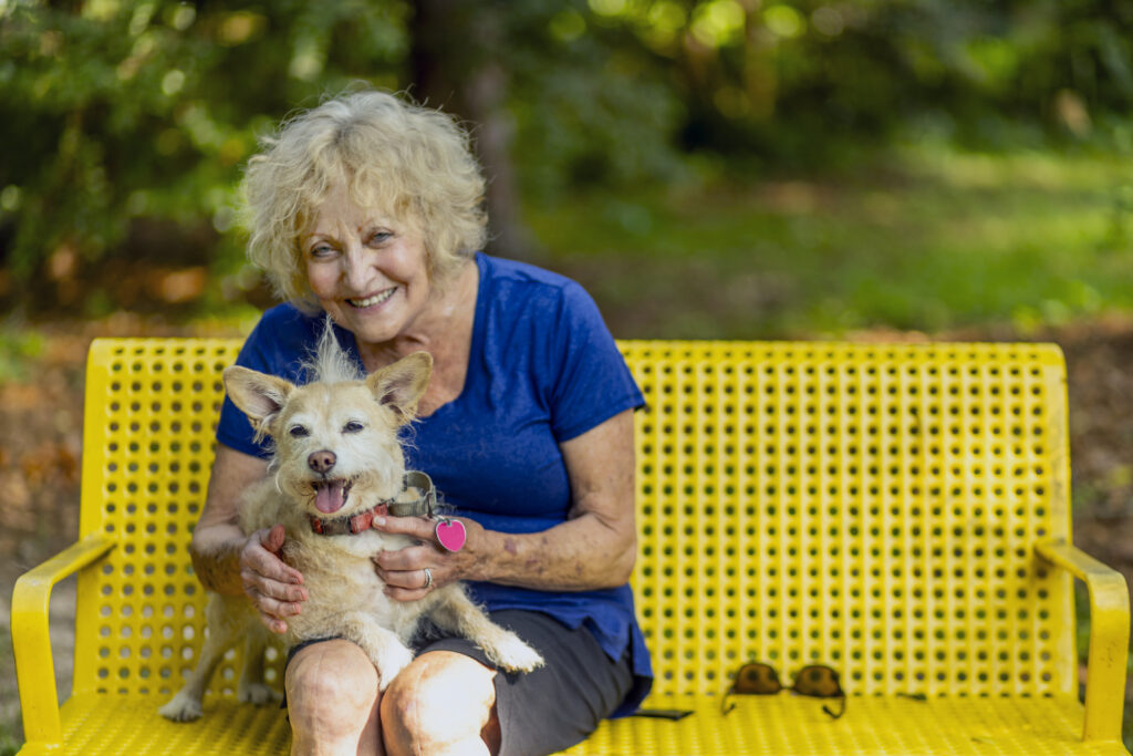 Smiling Senior Woman with Dog