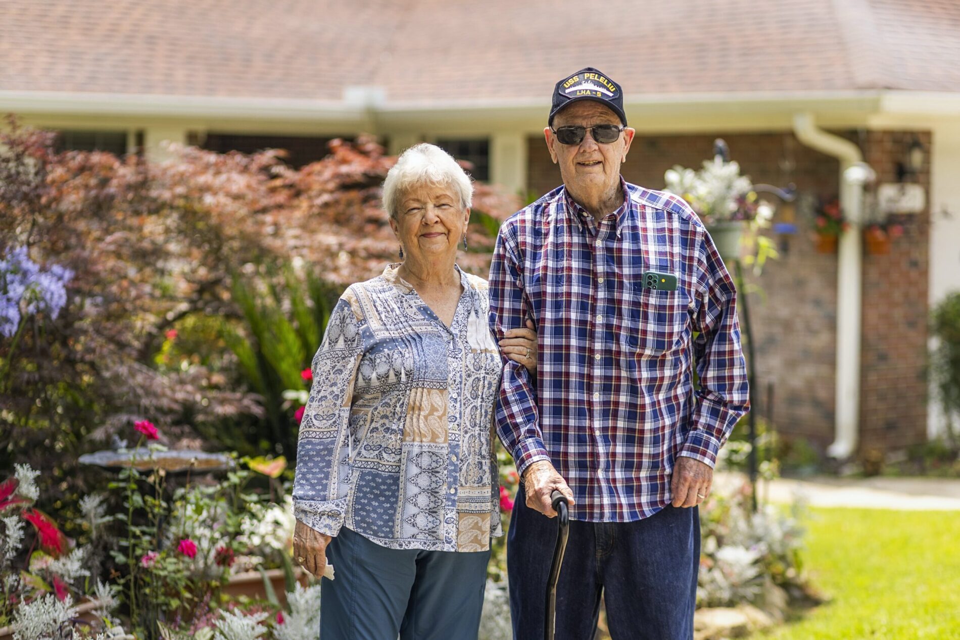 senior couple smiling outside
