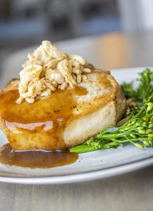 thick pork chop topped with lump crab meat