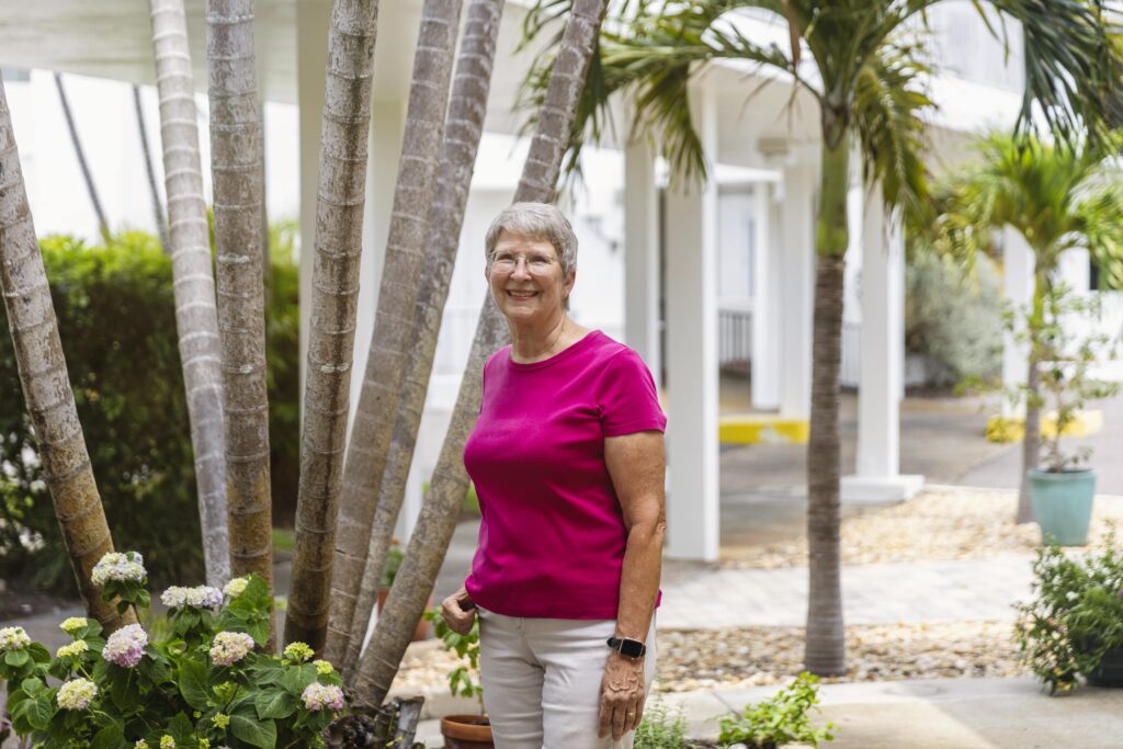 Senior woman photo by plants
