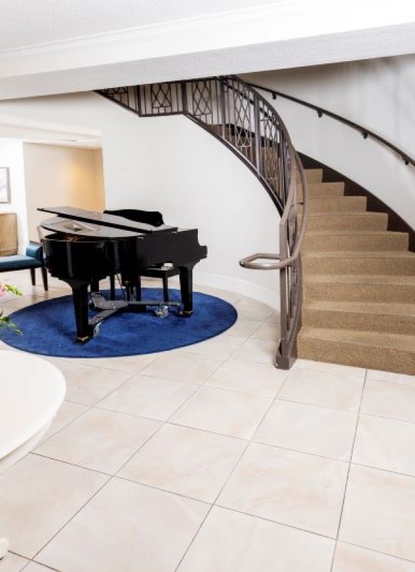 Lobby with piano and spiral staircase