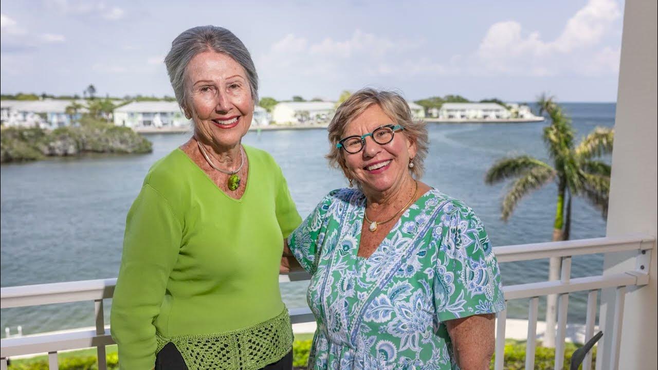 Seniors taking a photo with balcony view