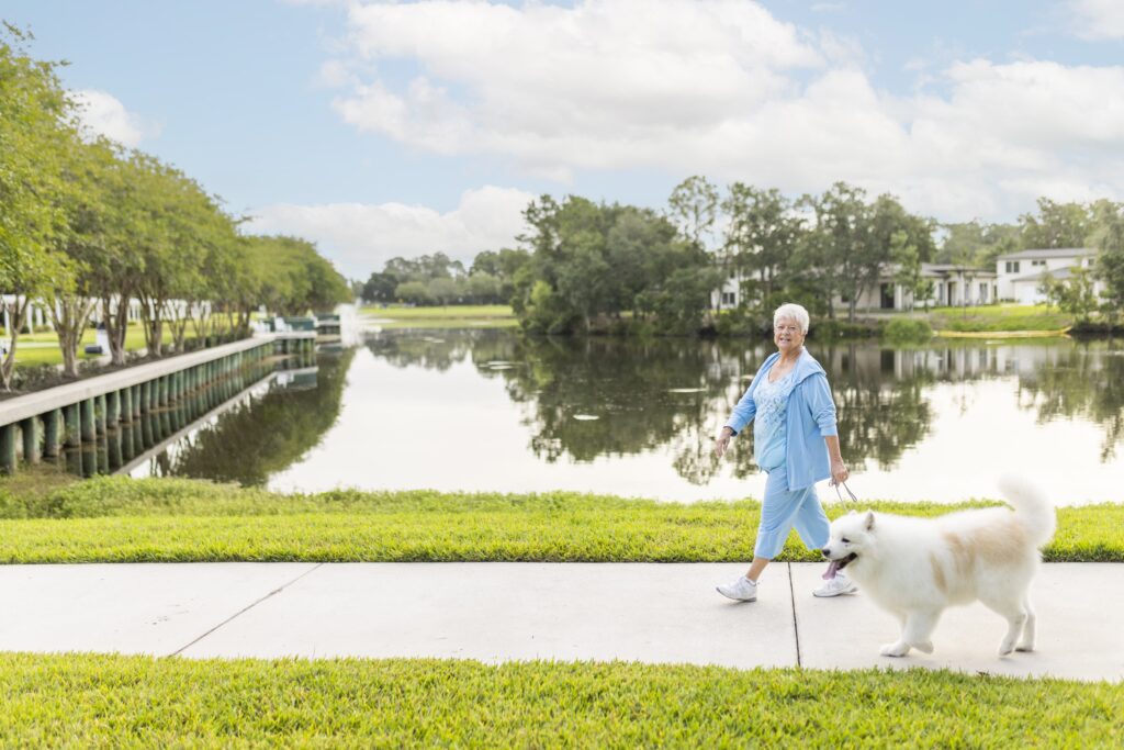 Senior woman walking her dog