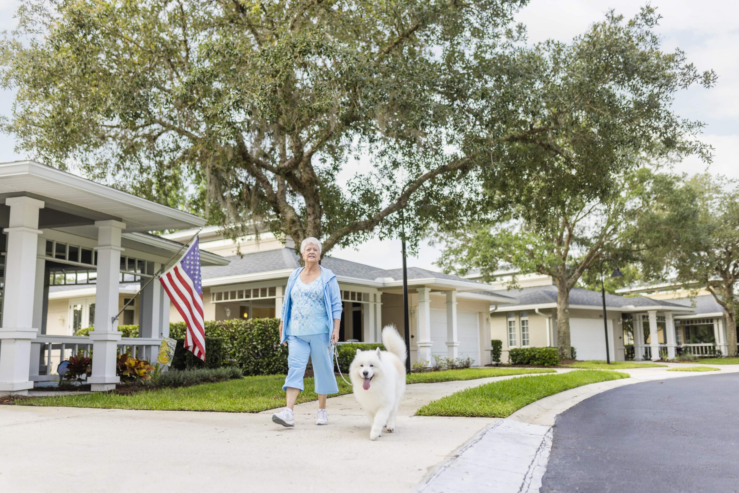 Senior woman walking her dog