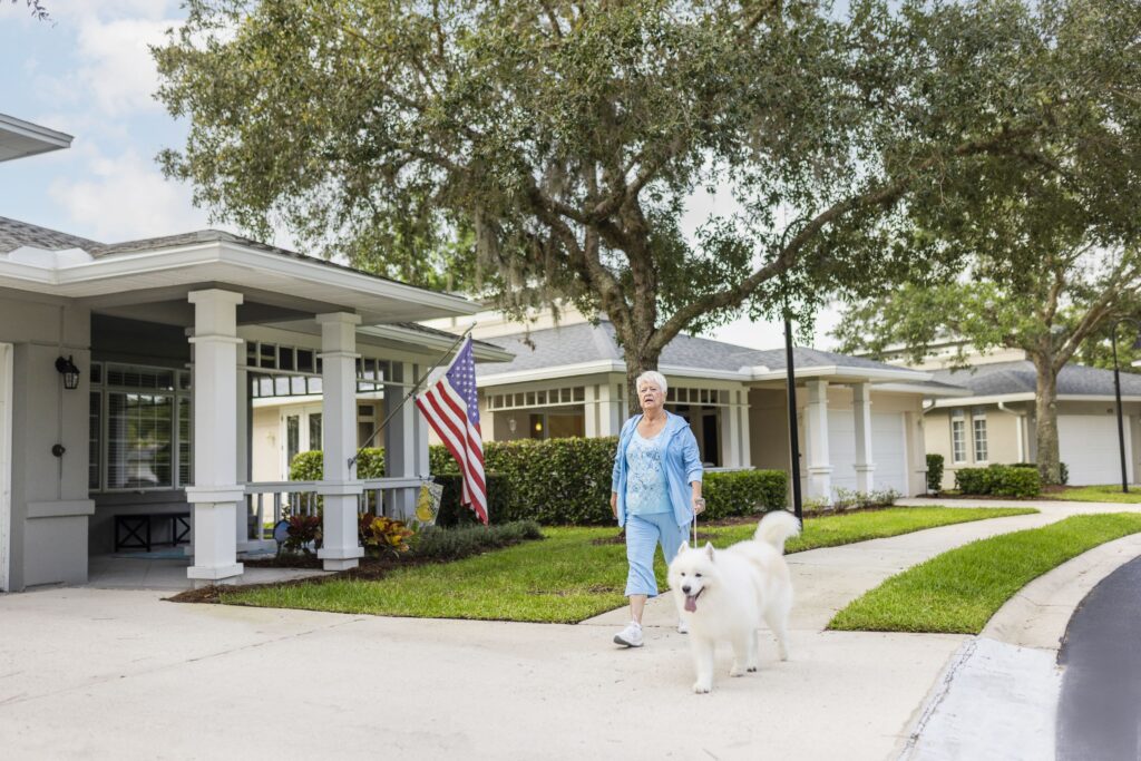 Senior woman walking her dog