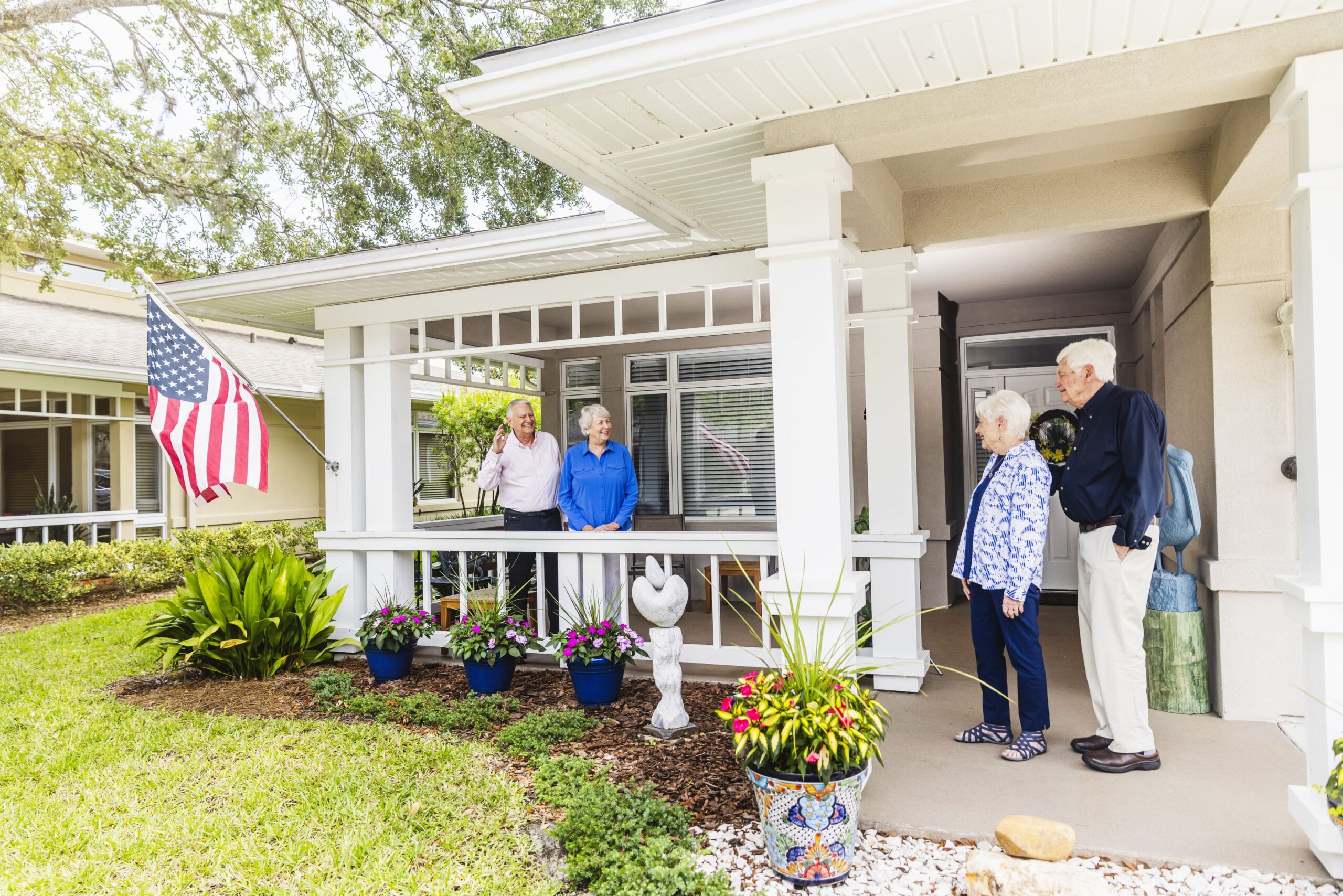 Seniors visiting their friends home greeted on porch