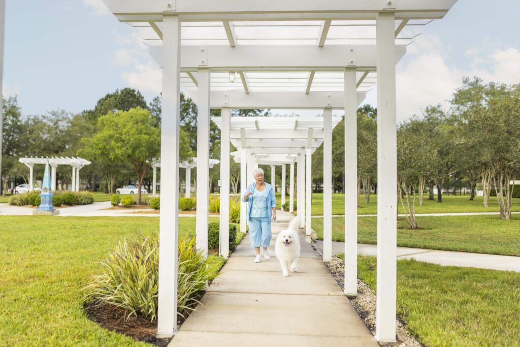Senior woman walking her dog