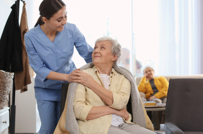 Nurse Helping Senior Woman