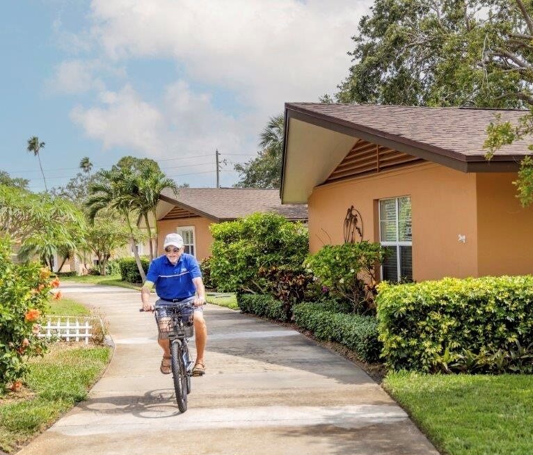 Senior riding his bike onsite