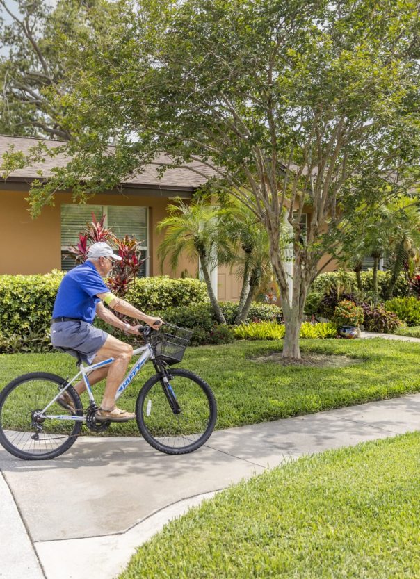 SUN – About Us – Maintenance Free Living -min senior riding bike