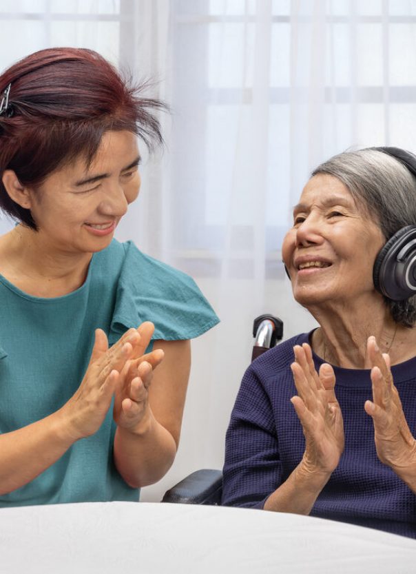 Music therapy in dementia treatment on elderly woman.