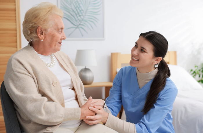 Nurse Helping Senior Woman
