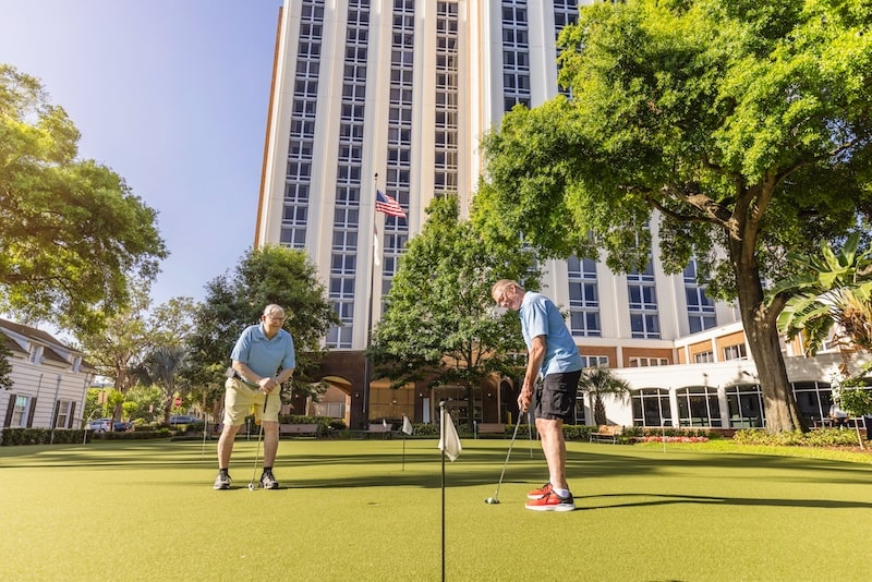 Seniors practicing putting