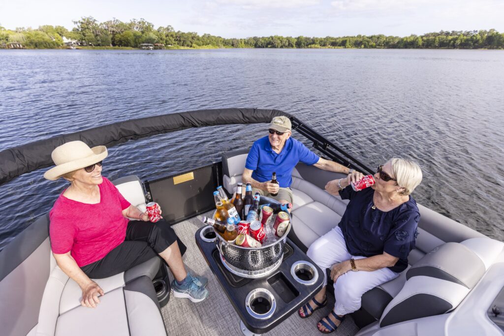 Seniors sharing drinks on their boat