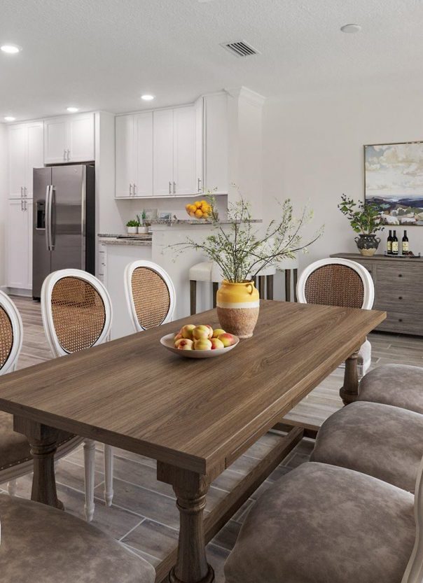bright open dining room looking into modern white kitchen