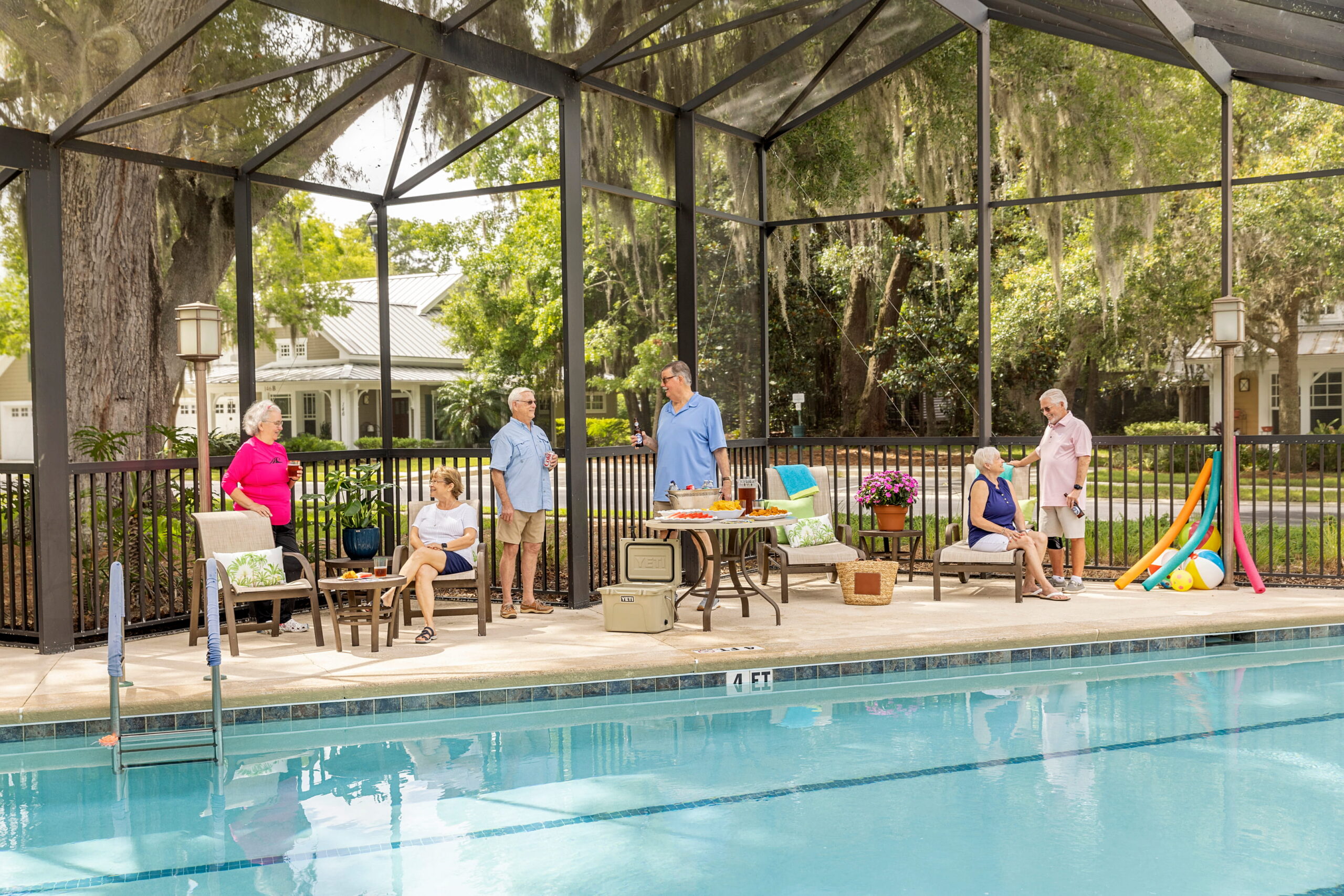 seniors lounging by pool