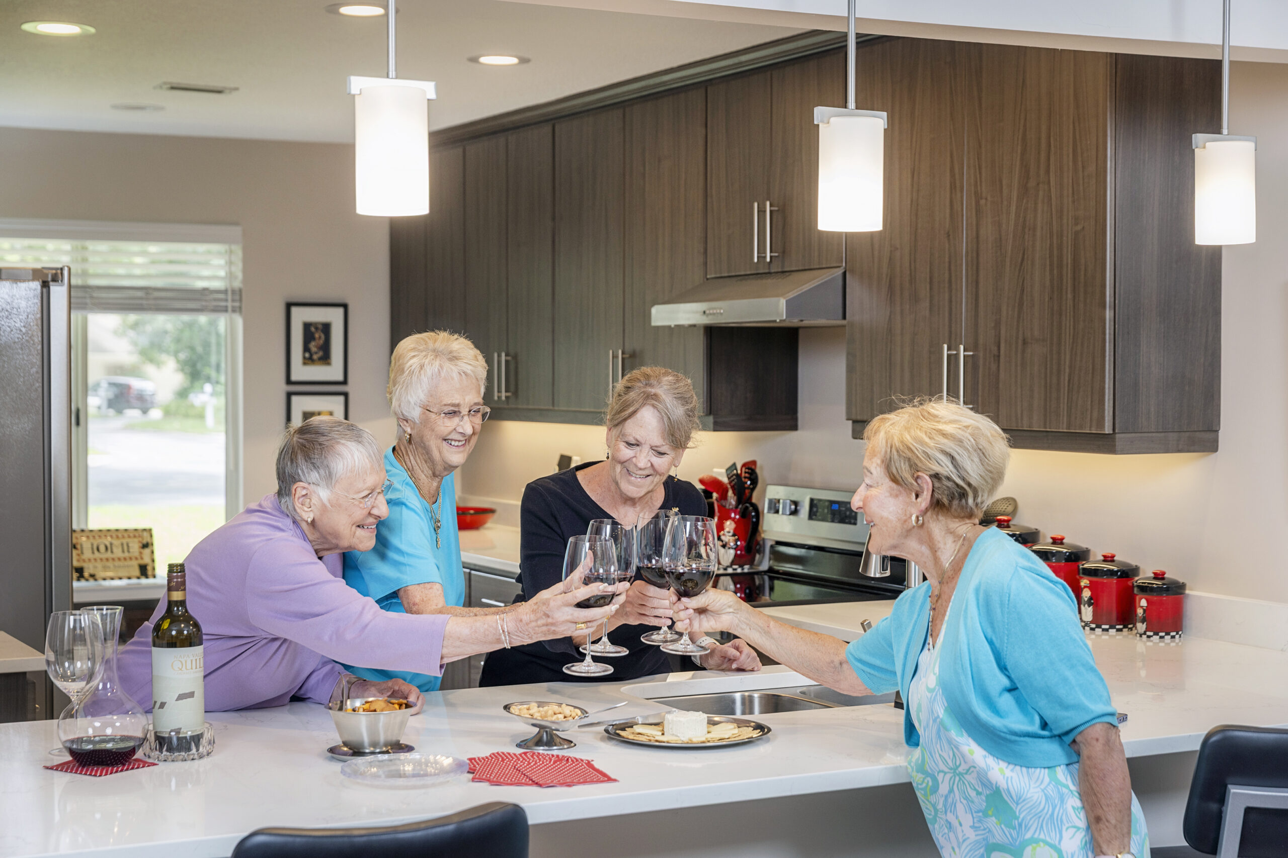 seniors cheersing at kitchen