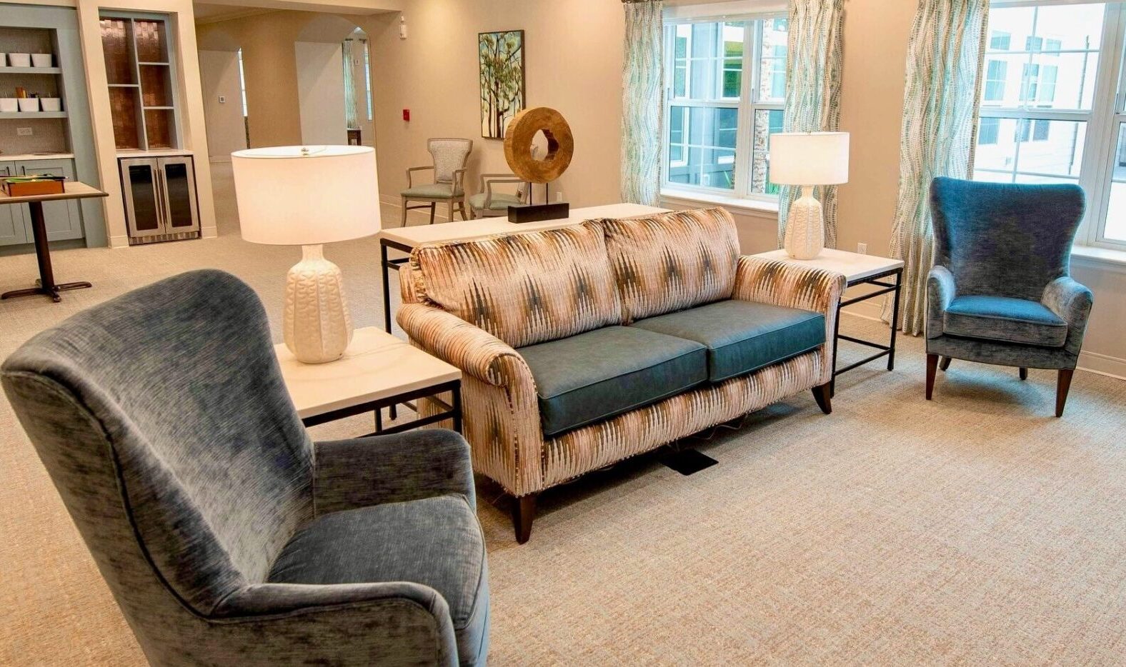 contemporary living room with large windows and fireplace