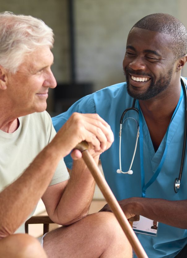 Male Nursing Help Senior Male, Smiling