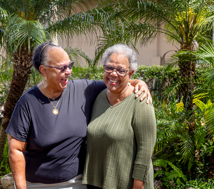 Two women hugging and smiling at Westminster Lakeland