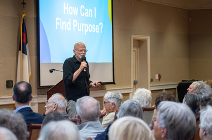 CEO of Growing Bolder, Marc Middleton, speaks to a group of older adults