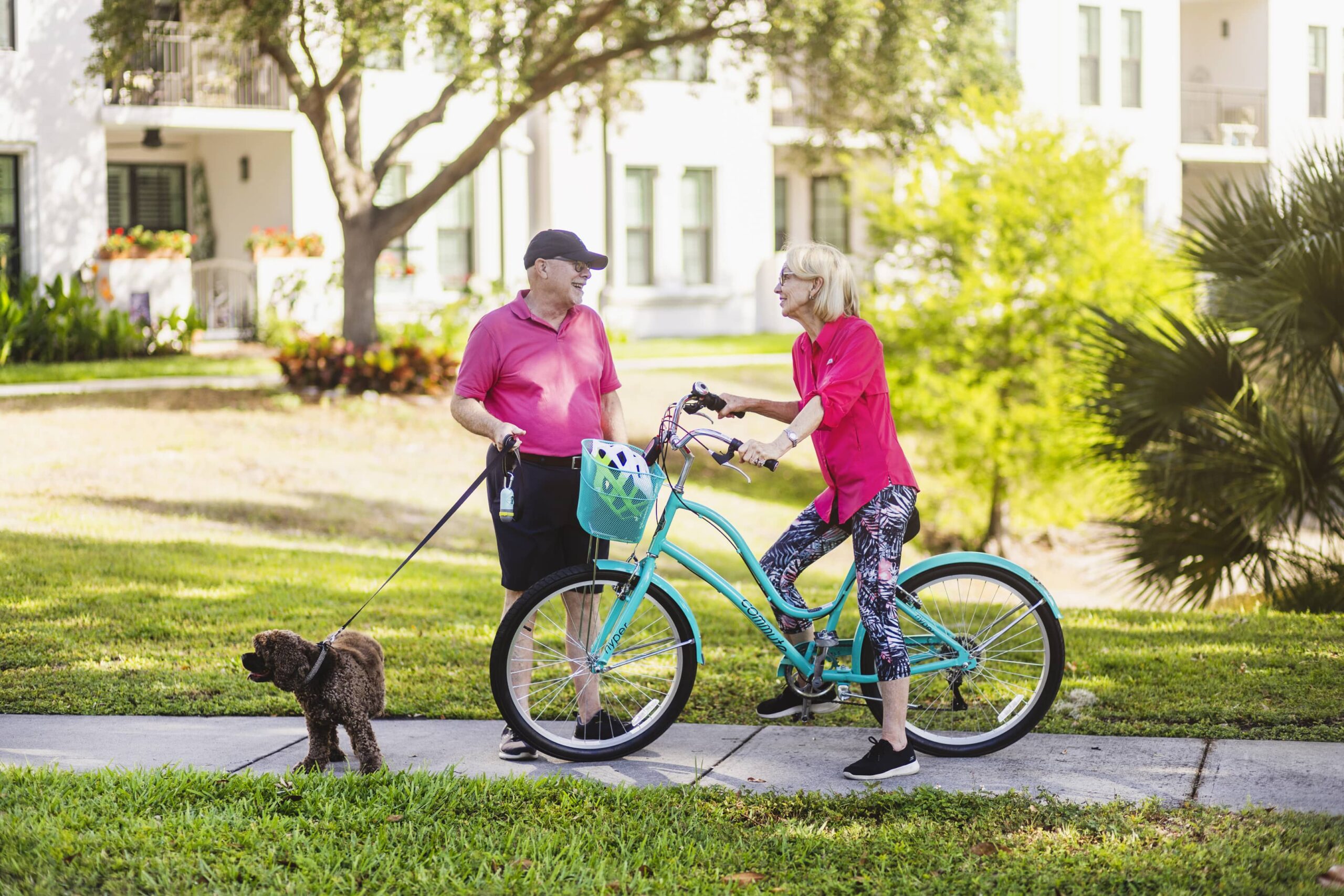 Seniors on a walk and bike ride stop for a chat