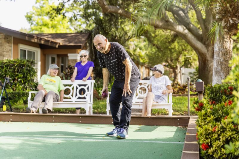 Senior playing backyard games