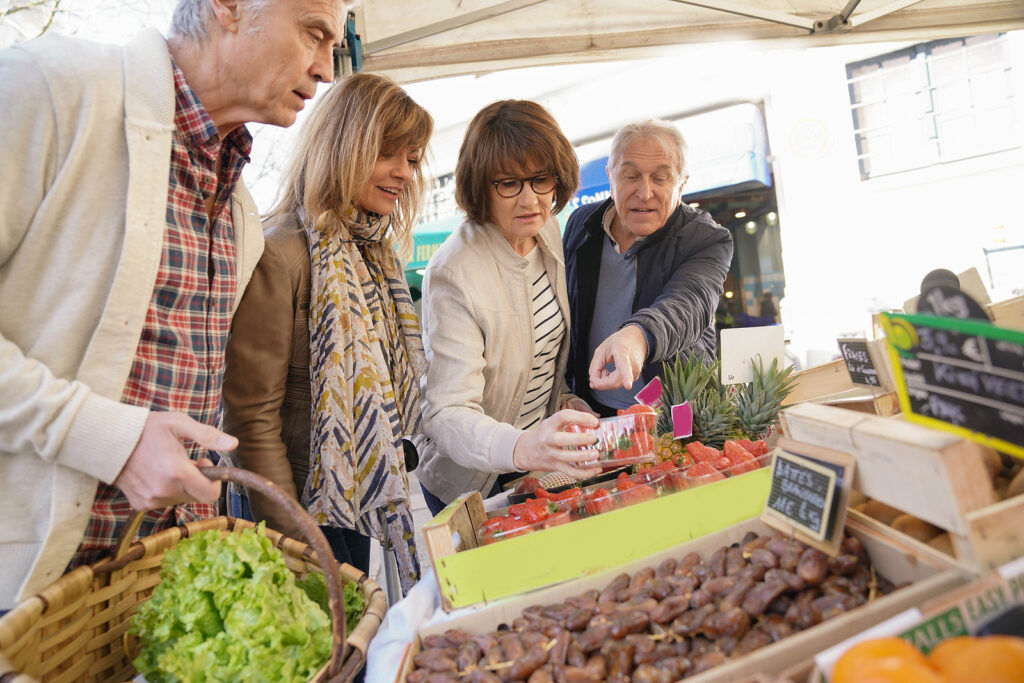 Seniors enjoying a farmers' market during the fall season in Florida