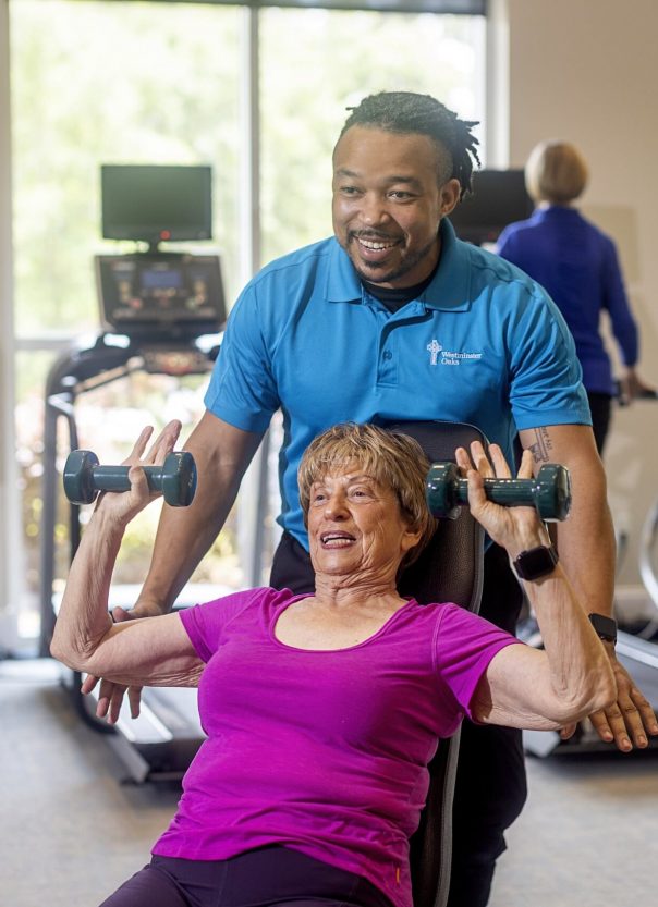 Rehab_1252-min Senior getting helped with exercise