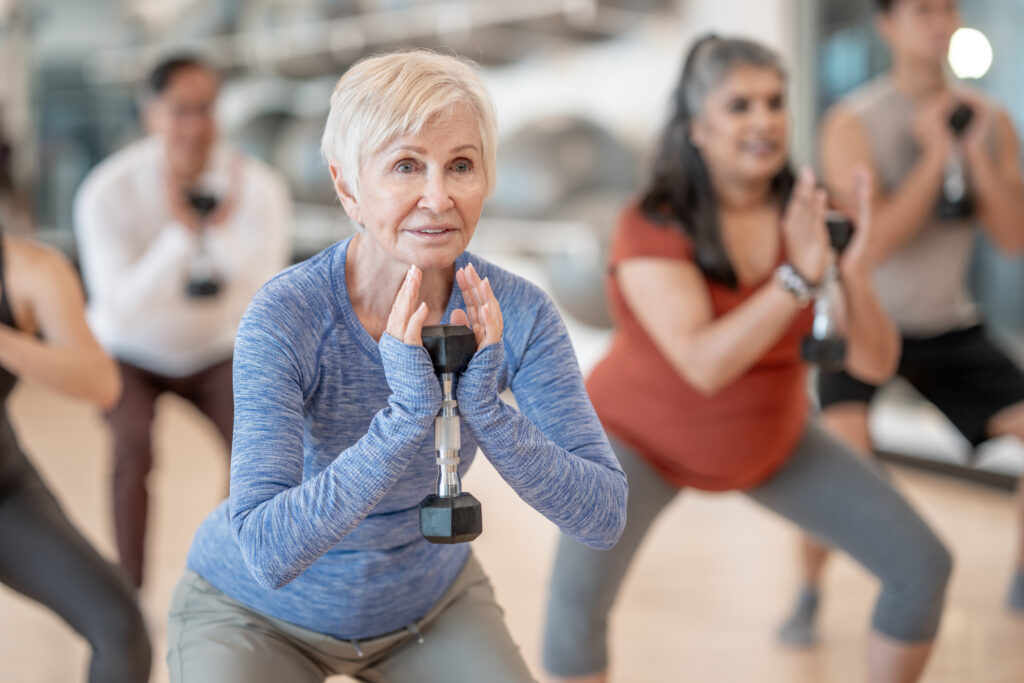 Group of seniors participating in a group strength training class